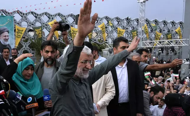 Candidate for the June 28, presidential election, Saeed Jalili, a former Iran's top nuclear negotiator, waves to his supporters during a campaign rally in Tehran, Iran, Monday, June 24, 2024. (AP Photo/Vahid Salemi)