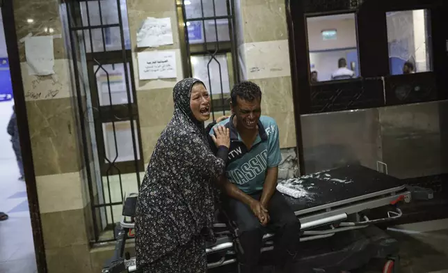 Palestinians react after their relative was killed in Israeli bombardment of the Gaza Strip at a hospital in Khan Younis, Thursday, June. 27, 2024. (AP Photo/Jehad Alshrafi)