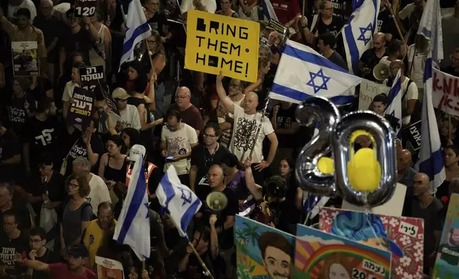 People protest against Israeli Prime Minister Benjamin Netanyahu's government and call for the release of hostages held in the Gaza Strip by the Hamas militant group, in Tel Aviv, Israel, Saturday, June 22, 2024. (AP Photo/Leo Correa)