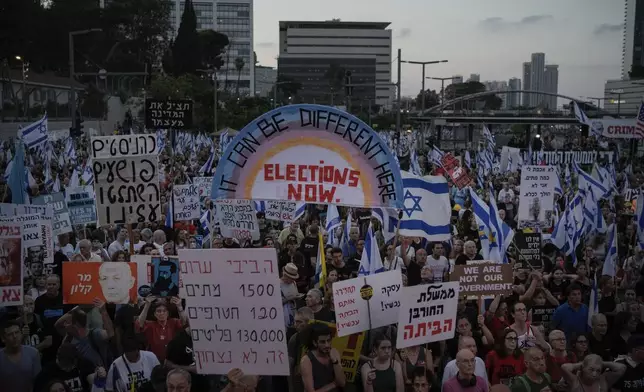 People attend a protest against Israeli Prime Minister Benjamin Netanyahu's government and demanding elections, in Tel Aviv, Israel, Saturday, June 22, 2024. (AP Photo/Leo Correa)