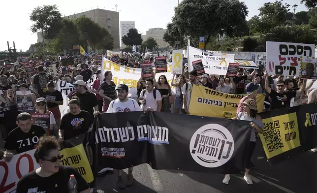 Students march towards The Knesset, Israel's parliament, to call for a deal to release hostages held by Hamas in the Gaza Strip, in Jerusalem, Thursday, June 13, 2024. (AP Photo/Mahmoud Illean)