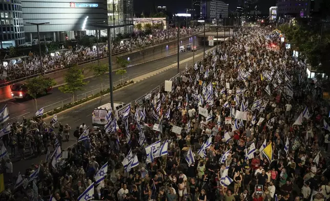 People protest against Israeli Prime Minister Benjamin Netanyahu's government and call for the release of hostages held in the Gaza Strip by the Hamas militant group, in Tel Aviv, Israel, Saturday, June 22, 2024. (AP Photo/Leo Correa)