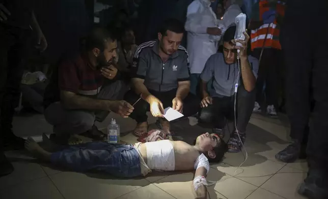 An injured Palestinian girl is treated at Al-Aqsa Martyrs Hospital in Deir al Balah, Gaza Strip, Friday, June 14, 2024. An Israeli airstrike on a home in the central city in the Gaza Strip killed two people and wounded several others including children, hospital officials said. (AP Photo/Mohammad Hajjar)