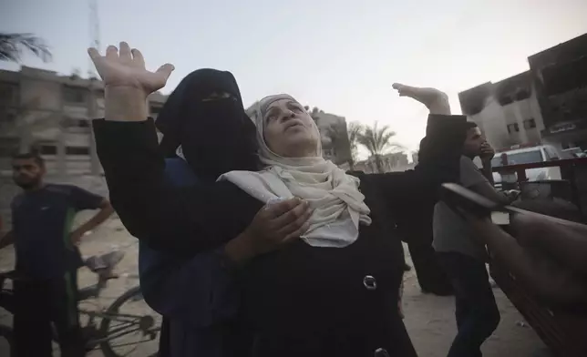 Palestinian women mourn loved ones killed by Israeli bombardment, during their funeral in Khan Younis, southern Gaza Strip, Friday, June 21, 2024. (AP Photo /Jehad Alshrafi)