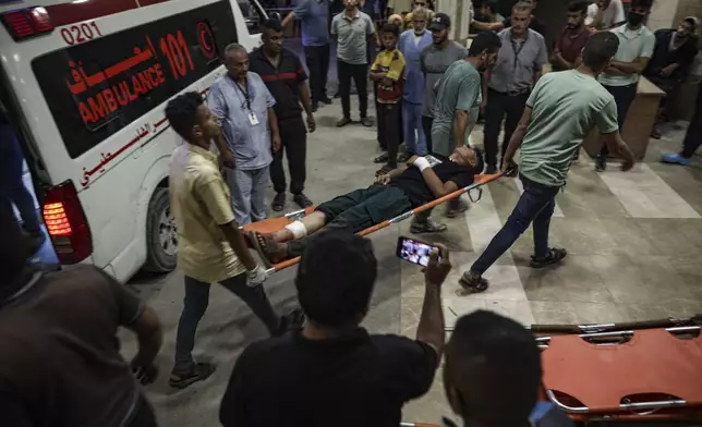 Palestinians wounded in Israeli bombardment of the Gaza Strip are brought to a hospital in Khan Younis, Thursday, June. 27, 2024. (AP Photo/Jehad Alshrafi)
