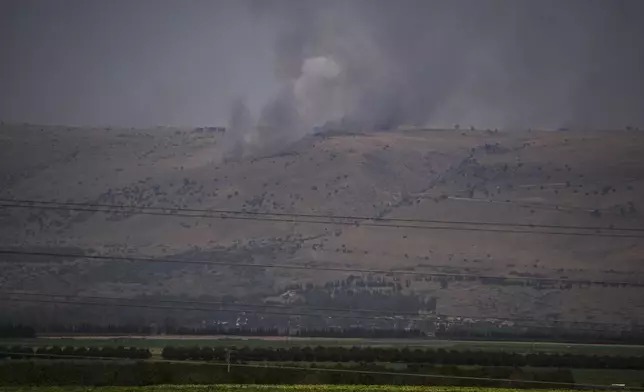 Smoke rises to the sky as a fire burns an area after a Lebanese shelling, in the Israeli-controlled Golan Heights, Thursday, June 13, 2024. (AP Photo/Leo Correa)