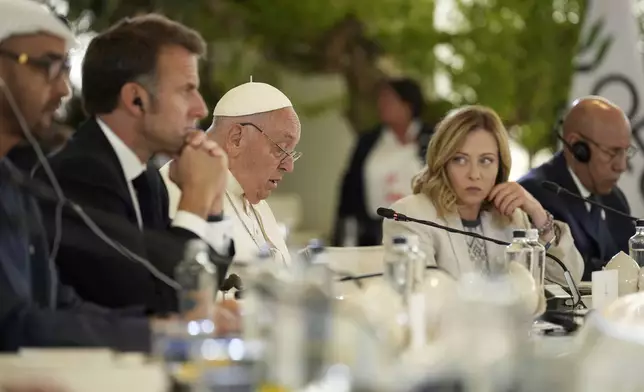 From left, United Arab Emirates President Sheikh Mohamed bin Zayed Al Nahyan, French President Emmanuel Macron, Pope Francis and Italy's Prime Minister Giorgia Meloni listen to the pontiff speaking during a working session on Artificial Intelligence (AI), Energy, Africa-Mediterranean, on day two of the 50th G7 summit at Borgo Egnazia, southern Italy, on Friday, June 14, 2024. (Christopher Furlong/Pool Photo via AP)