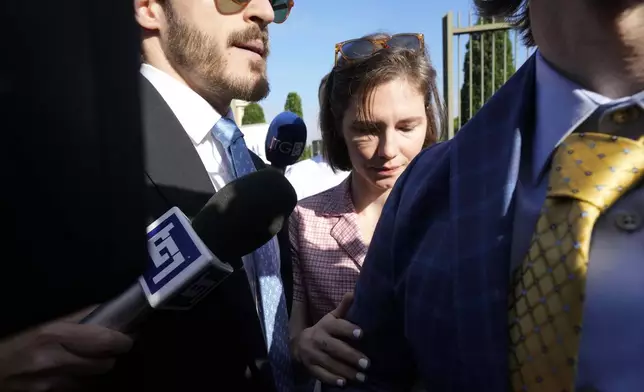 Amanda Knox arrives at the Florence courtroom in Florence, Italy, Wednesday, June 5, 2024. Amanda Knox returns to an Italian courtroom Wednesday for the first time in more than 12½ years to clear herself "once and for all" of a slander charge that stuck even after she was exonerated in the brutal 2007 murder of her British roommate in the idyllic hilltop town of Perugia. (AP Photo/Antonio Calanni)