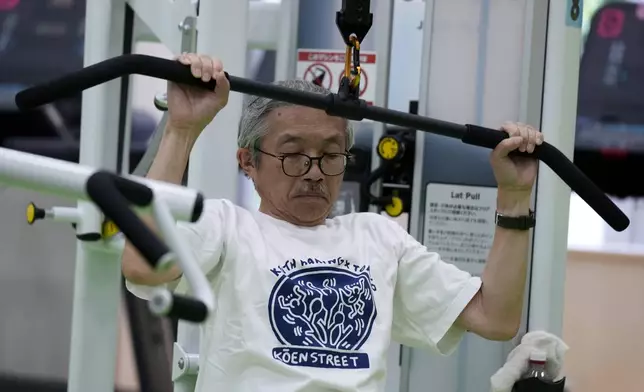 Toshiyuki Honma, 70, uses a lat pulldown machine as he works out at the Fukagawa Sports Center in Tokyo, Wednesday, June 12, 2024. If you are getting up there in years, weight-resistance training might deliver unexpected benefits. (AP Photo/Hiro Komae)