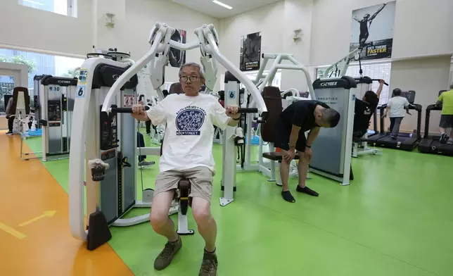 Toshiyuki Honma, 70, uses a chest press machine as he works out at the Fukagawa Sports Center in Tokyo, Wednesday, June 12, 2024. If you are getting up there in years, weight-resistance training might deliver unexpected benefits. (AP Photo/Hiro Komae)