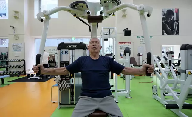 Shigeo Takahashi, 83, uses a pec deck machine as he works out at the Fukagawa Sports Center in Tokyo, Wednesday, June 12, 2024. If you are getting up there in years, weight-resistance training might deliver unexpected benefits. (AP Photo/Hiro Komae)