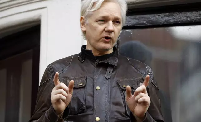 FILE - Julian Assange speaks to the media outside the Ecuadorian embassy in London, May 19, 2017. Assange will plead guilty to a felony charge in a deal with the U.S. Justice Department that will free him from prison and resolve a long-running legal saga over the publication of a trove of classified documents. (AP Photo/Frank Augstein, File)