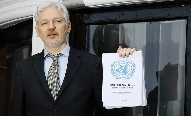 FILE - WikiLeaks founder Julian Assange speaks on the balcony of the Ecuadorean Embassy in London, Feb. 5, 2016. Assange will plead guilty to a felony charge in a deal with the U.S. Justice Department that will free him from prison and resolve a long-running legal saga over the publication of a trove of classified documents. (AP Photo/Kirsty Wigglesworth, File)