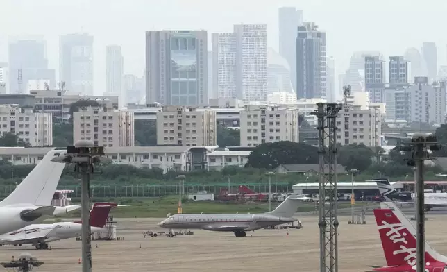 The plane thought to be carrying WikiLeaks' Julian Assange, on his way to enter a plea deal in U.S. court, is seen parked in Bangkok, Thailand, Tuesday, June 25, 2024. (AP Photo/Sakchai Lalit)