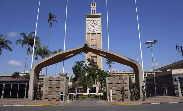 Kenya anti riot police patrol outside parliament in downtown Nairobi, Kenya, Wednesday, June 26, 2024. Thousands of protesters stormed and burned a section of Kenya's parliament Tuesday to protest tax proposals. Police responded with gunfire and several protesters were killed. (AP Photo/Brian Inganga)