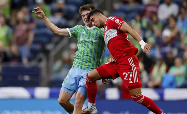 Seattle Sounders midfielder Reed Baker-Whiting, left, and Chicago Fire defender Allan Arigoni go up for a head ball during the first half of an MLS soccer match Saturday, June 29, 2024 in Seattle. (Jennifer Buchanan/The Seattle Times via AP)