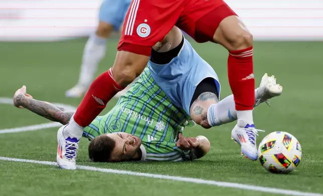 Seattle Sounders midfielder Albert Rusnák can only watch as Chicago Fire midfielder Gastón Giménez dribbles away with the ball after a steal during the first half of an MLS soccer match Saturday, June 29, 2024 in Seattle. (Jennifer Buchanan/The Seattle Times via AP)