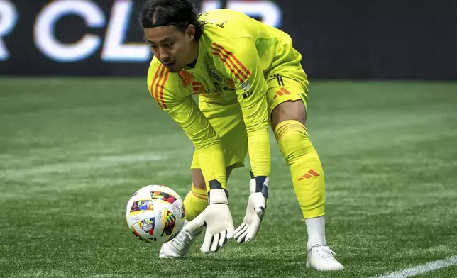 Vancouver Whitecaps goalkeeper Yohei Takaoka stops the ball against St. Louis City during the first half of an MLS soccer match Saturday, June 29, 2024, in Vancouver, British Columbia. (Ethan Cairns/The Canadian Press via AP)