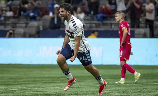 Vancouver Whitecaps' Brian White (24) celebrates after scoring against St. Louis City during the second half of an MLS soccer match Saturday, June 29, 2024, in Vancouver, British Columbia. (Ethan Cairns/The Canadian Press via AP)