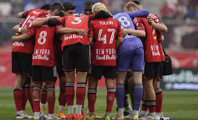 New York Red Bulls players huddle before an MLS soccer match against Toronto FC, Saturday, June 22, 2024, in Harrison, N.J. (AP Photo/Julia Nikhinson)