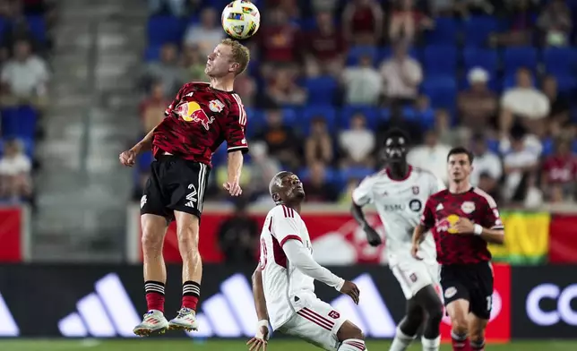 New York Red Bulls defender Dennis Gjengaar (2) goes up for a header during an MLS soccer match against Toronto FC, Saturday, June 22, 2024, in Harrison, N.J. (AP Photo/Julia Nikhinson)