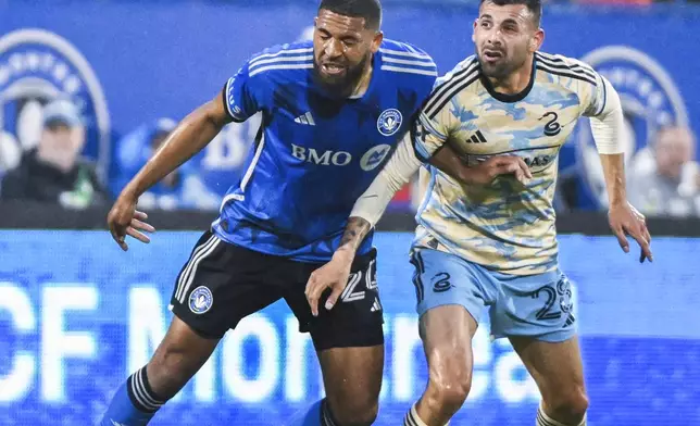CF Montreal's George Campbell (24) and Philadelphia Union forward Tai Baribo (28) work for the ball during the first half of an MLS soccer match Saturday, June 29, 2024, in Montreal. (Graham Hughes/The Canadian Press via AP)