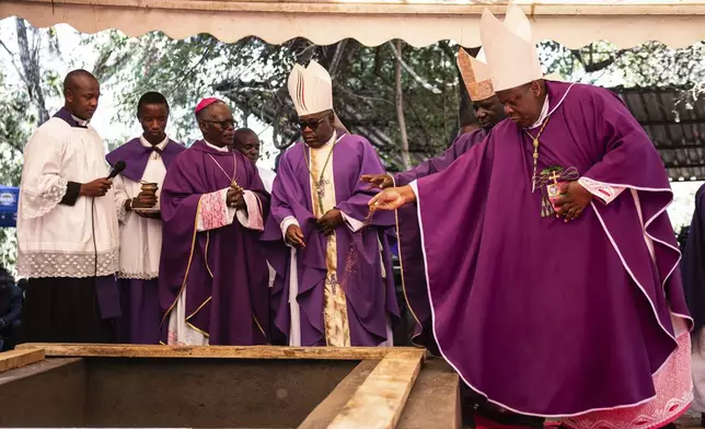 The clergy conduct a burial service for Malawi's Vice President Saulos Chilima in Nsipe, Malawi, Monday, June 17, 2024. (AP Photo/Thoko Chikondi)