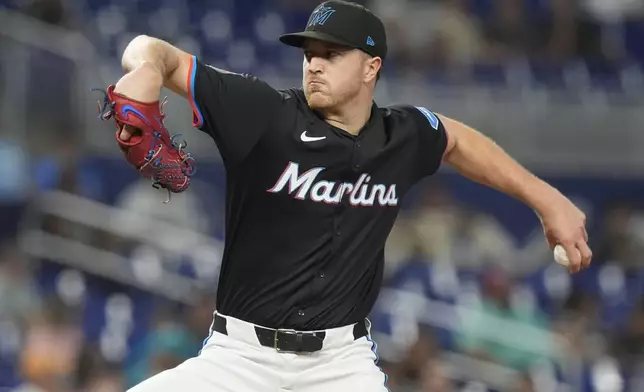 Miami Marlins pitcher Trevor Rogers aims a pitch during the first inning of a baseball game against the Seattle Mariners, Friday, June 21, 2024, in Miami. (AP Photo/Marta Lavandier)