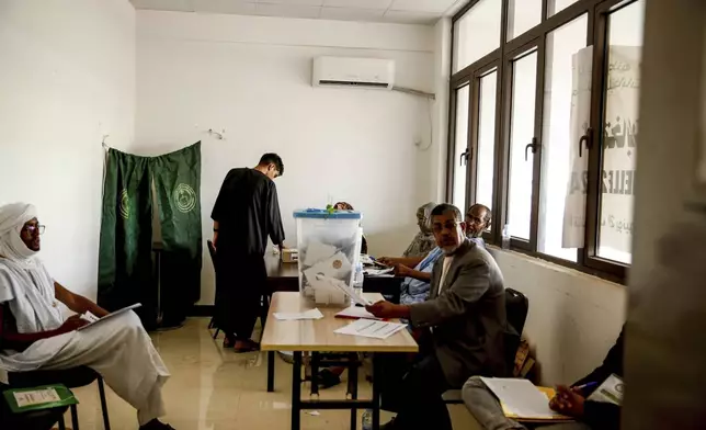 A man casts his ballot, during the presidential election, in Nouakchott, Mauritania, Saturday, June 29, 2024. Mauritanians are voting for their next president, with the incumbent Mohamed Ould Ghazouani widely expected to win the vote after positioning Mauritania as a strategic ally of the West in a region swept by coups and violence. (AP Photo/Mamsy Elkeihel)