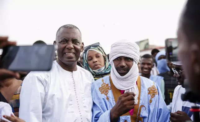 Presidential candidate Biram Ould Dah Ould Abeid, left, takes part in a rally among his supporters, ahead of the presidential election end of the month, in Nouakchott, Mauritania, Monday, June 24, 2024. (AP Photo/Mamsy Elkeihel)