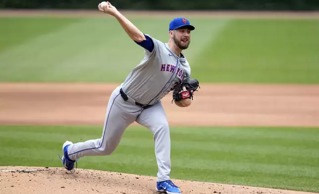 New York Mets pitcher Tylor Megill delivers in the first inning of a baseball game against the Chicago Cubs, Saturday, June 22, 2024, in Chicago. (AP Photo/Charles Rex Arbogast)