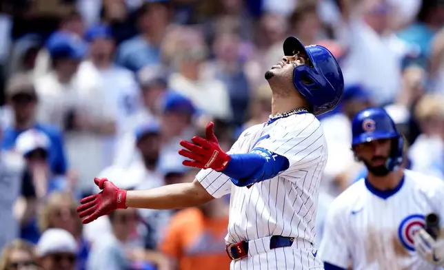 Chicago Cubs' Christopher Morel celebrates his home run off New York Mets starting pitcher Tylor Megill in the third inning of a baseball game Saturday, June 22, 2024, in Chicago. (AP Photo/Charles Rex Arbogast)