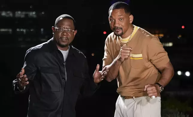 Actors Martin Lawrence, left, and Will Smith, strike a pose during a photo shoot to promote their latest film, "Bad Boys: Ride or Die", in Mexico City, Friday, May 31, 2024. (AP Photo/Matias Delacroix)