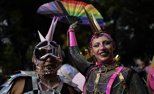 Participants pose for a photo during the annual Gay Pride parade marking the culmination of LGBTQ+ Pride month, in Mexico City, Saturday, June 29, 2024. (AP Photo/Aurea Del Rosario)