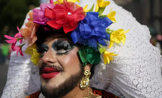 A participant poses for a photo during the annual Gay Pride parade marking the culmination of LGBTQ+ Pride month, in Mexico City, Saturday, June 29, 2024. (AP Photo/Aurea Del Rosario)