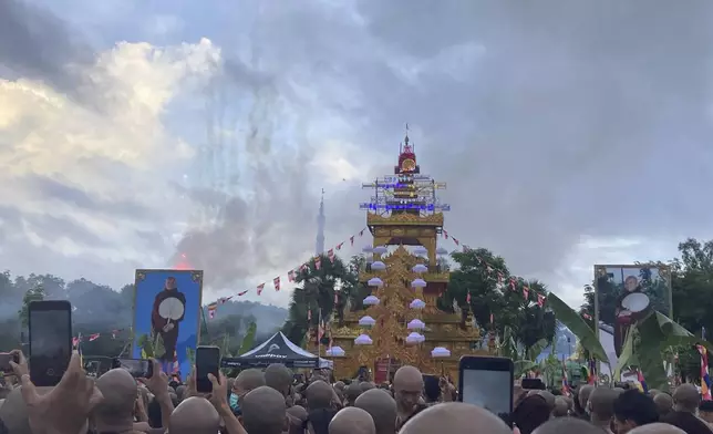 A crowd of Buddhist clergy and devotees attend the cremation of the late monk Bhaddanta Munindarbhivamsa in Bago, Myanmar, Thursday, June 27, 2024. The senior monk was shot dead last week by soldiers who the military government said mistaked the vehicle in which he was traveling for a security threat. (AP Photo)