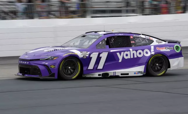 Denny Hamlin steers his car out of Turn 4 during a NASCAR Cup Series race, Sunday, June 23, 2024, at New Hampshire Motor Speedway, in Loudon, N.H. (AP Photo/Steven Senne)