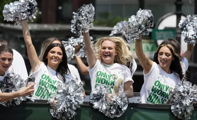 Boston Celtics cheerleaders celebrate the team's NBA basketball championship win during a duck boat parade Friday, June 21, 2024, in Boston. (AP Photo/Michael Dwyer)
