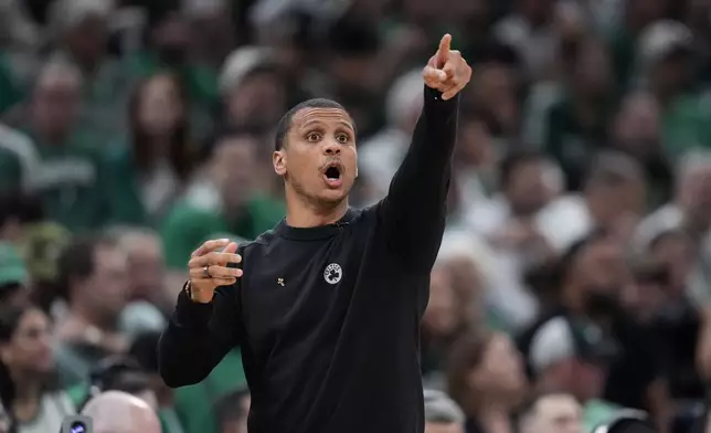 Boston Celtics coach Joe Mazzulla calls to players during the first half of Game 1 of the basketball team's NBA Finals against the Dallas Mavericks, Thursday, June 6, 2024, in Boston. (AP Photo/Charles Krupa)