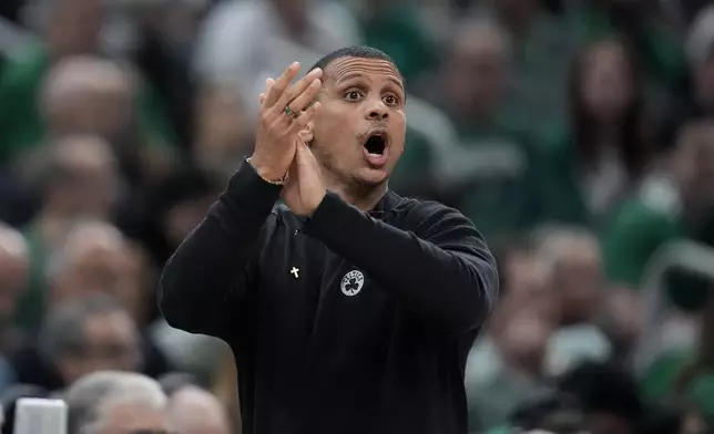 Boston Celtics coach Joe Mazzulla calls to players during the first half of Game 1 of the basketball team's NBA Finals against the Dallas Mavericks, Thursday, June 6, 2024, in Boston. (AP Photo/Charles Krupa)