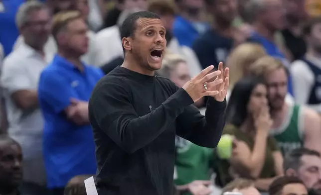 Boston Celtics head coach Joe Mazzulla signals to players during the first half in Game 4 of the NBA basketball finals against the Dallas Mavericks, Friday, June 14, 2024, in Dallas. (AP Photo/Julio Cortez)