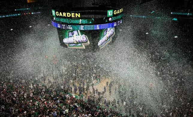 Confetti falls after the Boston Celtics defeated the Dallas Mavericks in Game 5 of the NBA basketball finals, Monday, June 17, 2024, in Boston. (AP Photo/Michael Dwyer)