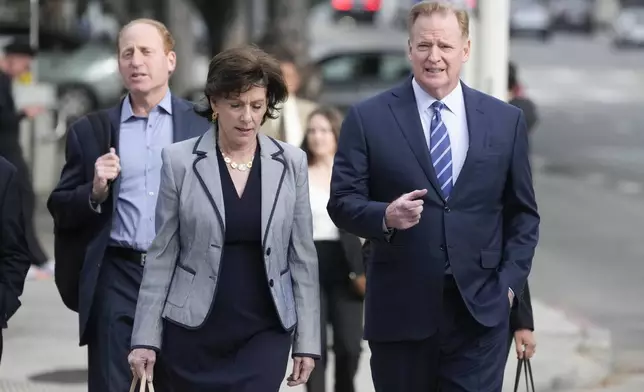 NFL Commissioner Roger Goodell, right, arrives at federal court Monday, June 17, 2024, in Los Angeles. Goodell is expected to testify as a class-action lawsuit filed by "Sunday Ticket" subscribers claiming the NFL broke antitrust laws. (AP Photo/Damian Dovarganes)