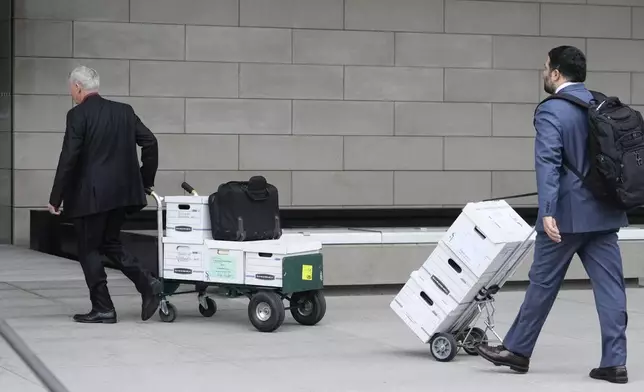 Documents to support Dallas Cowboys owner Jerry Jones' testimony are wheeled into federal court Tuesday, June 18, 2024, in Los Angeles. Jones is testifying in a class-action lawsuit filed by "Sunday Ticket" subscribers claiming the NFL broke antitrust laws. (AP Photo/Damian Dovarganes)