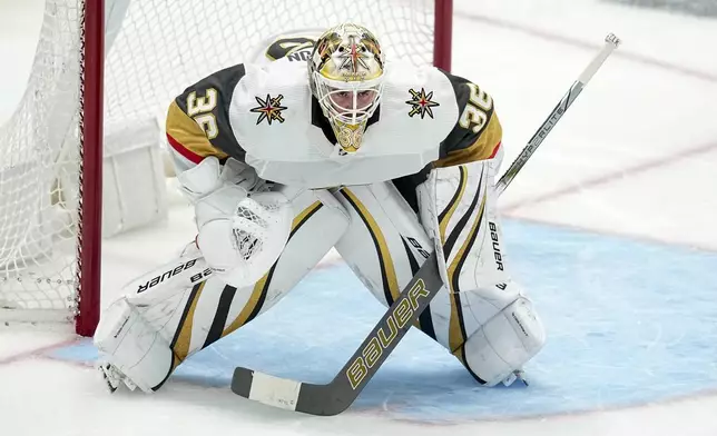 FILE - Vegas Golden Knights goaltender Logan Thompson defends his net against the Dallas Stars during the third period in Game 2 of an NHL hockey Stanley Cup first-round playoff series in Dallas, Wednesday, April 24, 2024. The Washington Capitals acquired goaltender Logan Thompson from Vegas and sent fourth-line winger Beck Malenstyn to Buffalo. (AP Photo/Tony Gutierrez, File)
