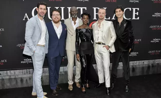 John Krasinski, from left, Michael Sarnoski, Djimon Hounsou, Lupita Nyong'o, Joseph Quinn and Alex Wolff attend the Paramount Pictures premiere of "A Quiet Place: Day One" at AMC Lincoln Square on Wednesday, June 26, 2024, in New York. (Photo by Evan Agostini/Invision/AP)