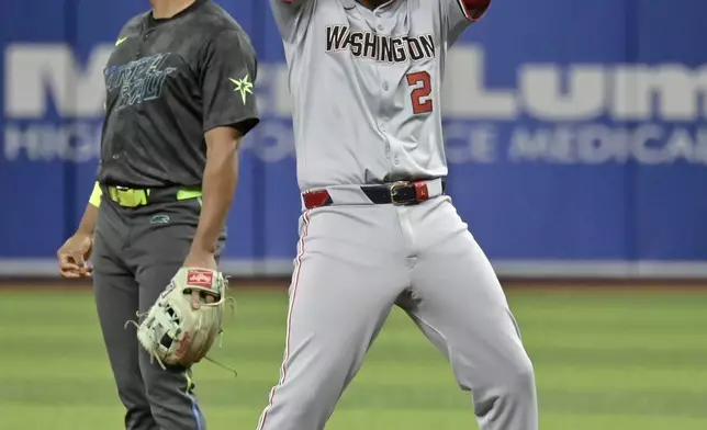 Tampa Bay Rays second baseman Richie Palacios, left, looks away as Washington Nationals' Luis Garcia Jr. (2) celebrates on second with a double during the first inning of a baseball game Saturday, June 29, 2024, in St. Petersburg, Fla. (AP Photo/Steve Nesius)
