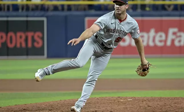 Washington Nationals reliever Jacob Barnes watches a throw to a Tampa Bay Rays batter during the sixth inning of a baseball game Friday, June 28, 2024, in St. Petersburg, Fla. (AP Photo/Steve Nesius)