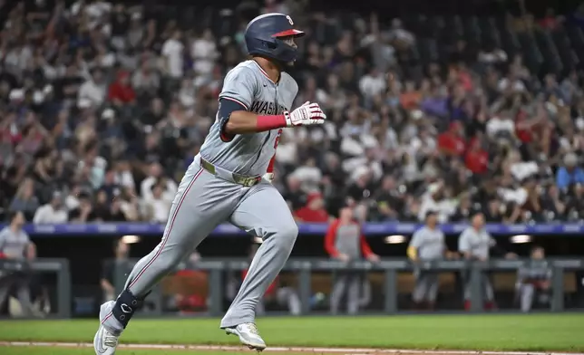 Washington Nationals' Luis García Jr. watches his two-run home run against the Colorado Rockies during the eighth inning of a baseball game Saturday, June 22, 2024, in Denver. (AP Photo/Geneva Heffernan)