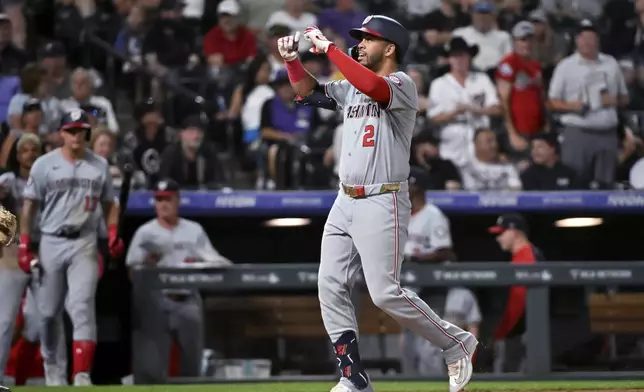 Washington Nationals' Luis García Jr. celebrates his two-run home run against the Colorado Rockies during the eighth inning of a baseball game Saturday, June 22, 2024, in Denver. (AP Photo/Geneva Heffernan)